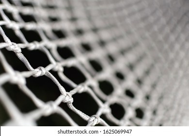 Detail Of Football Goal – White Net Of Ropes. Macro Or Close-up Of A Soccer Or Hockey Net – Shallow Depth Of Field. Football Concept Wallpaper Or Background. Texture Of Goal Net.