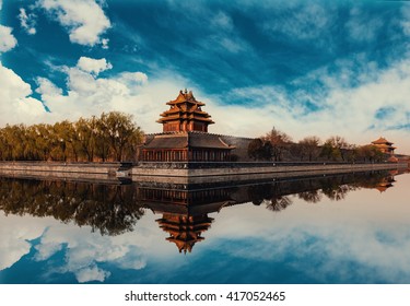 Detail of the Forbidden City with a beautiful reflection in a spring day in Beijing, China.