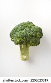 Detail Of Fresh And Healthy Brocoli Isolated On White Table. Vertical Composition.