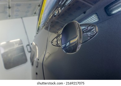 Detail Of Freshly Painted Car Door At A Auto Body Shop