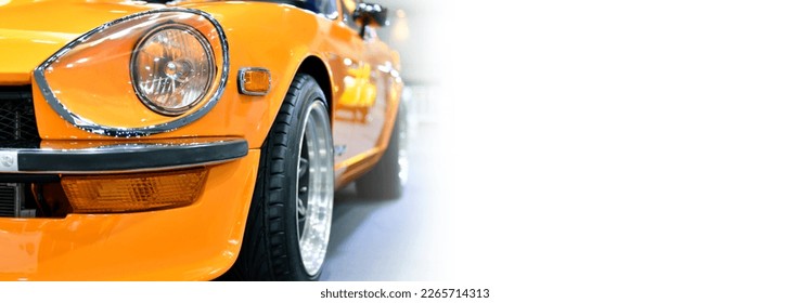 Detail front headlights of orange classic car, copy space	 - Powered by Shutterstock