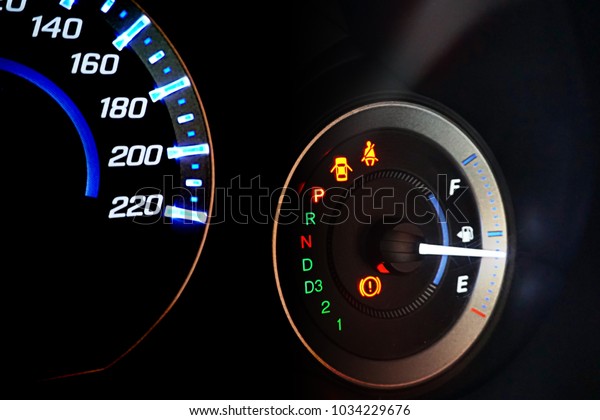 Detail gasoline with the fuel gauges showing\
and empty tank on\
dashboard