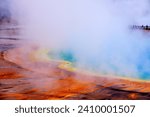 Detail of Grand Prismatic Spring with Steam in Yellowstone National Park on Rainy Day with People on the Boardwalk 