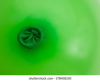 detail of a green balloon ring hole  