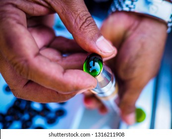 Detail Of Hand Holding Rare Gemstones, Very Rare Black Jade Gemstone Worth 10000 Dollars Each, Photo Taken In Minerals/gems Market In Mandalay, Myanmar (Burma)