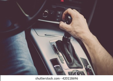 Detail Of A Hand Pulling An Automatic Gear Shifter In A New Car.