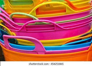 Detail of handles of Colored plastic baskets