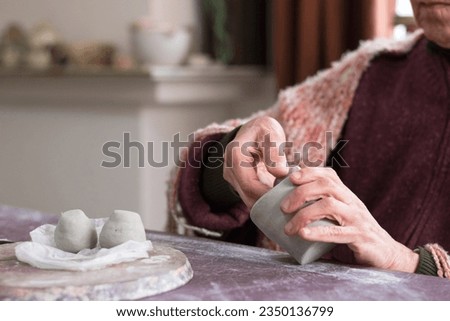 Similar – Caregiver checking blood pressure to a senior woman