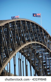 Detail Of Harbour Bridge In Sydney, Australia With Australian Flags