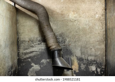 Detail Of Heavy Expanding Industrial Exhaust Hose In A  Welding Cubicle