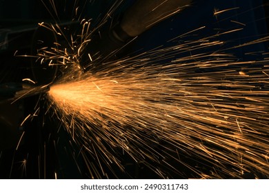 Detail of heavy industry manufacturing, sparks come out of a metal working welder. - Powered by Shutterstock