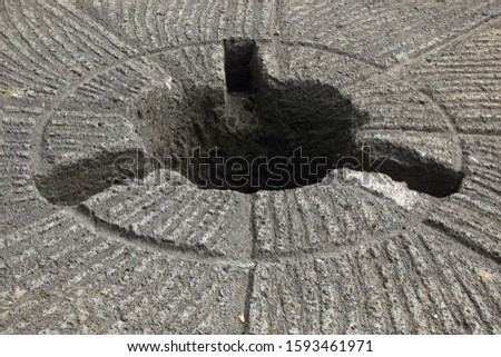 Detail of a historic millstone.