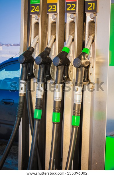 Detail of hoses\
of petrol pump at a gas\
station