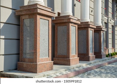 Detail of a house facade. Granite columns as decorative elements of the building.
