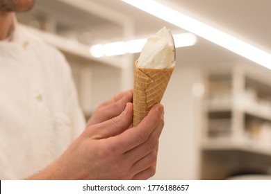 Detail Of An Ice Cream Man Serving Ice Cream Towards The Camera.