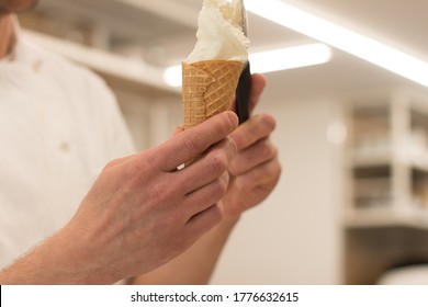 Detail Of An Ice Cream Man Serving Ice Cream Towards The Camera.