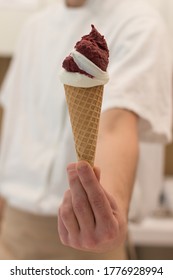 Detail Of An Ice Cream Man Serving Ice Cream Towards The Camera.