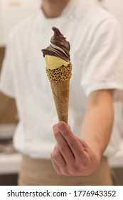 Detail Of An Ice Cream Man Serving Ice Cream Towards The Camera.