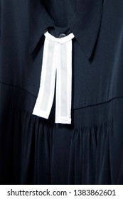 Detail Image Of A Black Gown With White Collar, Pastor Clothes, Protestant Church.