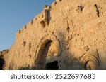 Detail of the intricate stone relief work and arches embellishing the Zion Gate in the Old City of Jerusalem.