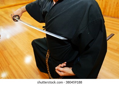 Detail of Japanese katana sword in hands of iaido fighter during training