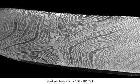 Detail of a knife made from a random pattern Damascus steel.