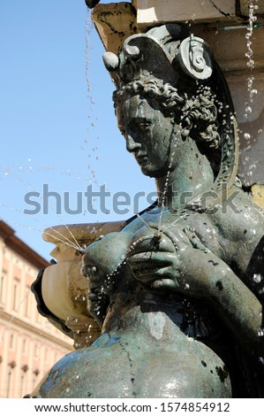 Detail with a lactating nereid. The Fountain of Neptune is a monumental civic fountain located in the eponymous square, Piazza del Nettuno. Bologna, Italy