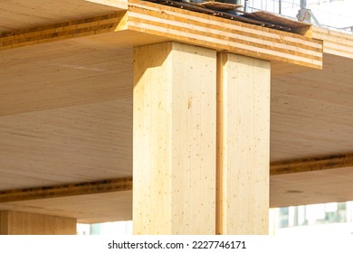 Detail of a laminated mass timber building construction project showing floor panel and support column - Shutterstock ID 2227746171