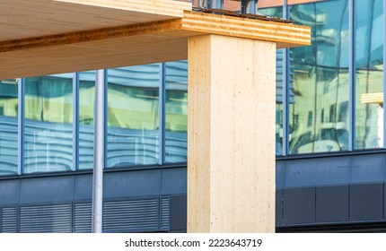 Detail of an laminated vertical column in a mass timber multi story green, sustainable, residential high rise apartment or commercial office building construction project - Shutterstock ID 2223643719