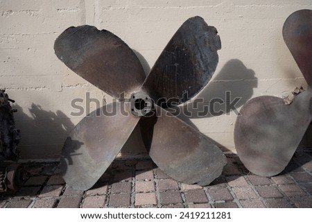 Detail of a large old four-bladed ship propeller from the Second World War