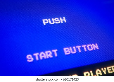 Detail Macro of an old vintage video game screen with text Push start button