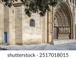 Detail of the main portal of the Gothic cathedral of Huesca, Spain. It features a large arch decorated with figures of martyrs, virgins, angels and prophets. It was built between 1302 and 1307