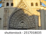 Detail of the main portal of the Gothic cathedral of Huesca, Spain. It features a large arch decorated with figures of martyrs, virgins, angels and prophets. It was built between 1302 and 1307