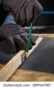 Detail making sheet metal roof components in workroom