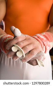 Detail Of Male Gymnast About To Perform Covering Hands In Chalk