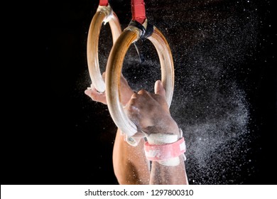 Detail Of Male Gymnast Catching Gymnastic Rings With Chalk Dust