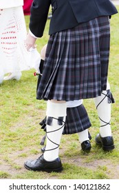 Detail Of Man And Child Wearing Kilt, Scotland