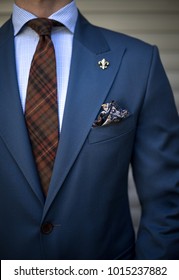 Detail Of Man In Tailored Suit Pocket Square And Tie