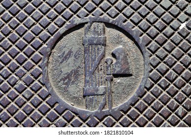 Detail of a manhole cover of the Apulian aqueduct with the original fasces of 1914. Lecce, Puglia / Italy