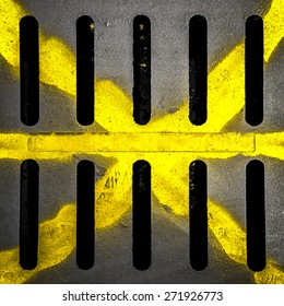 Detail Of A Manhole With Yellow X Drawn With Paint Spray.