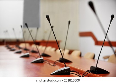 Detail With Many Microphones In A Press Conference Room