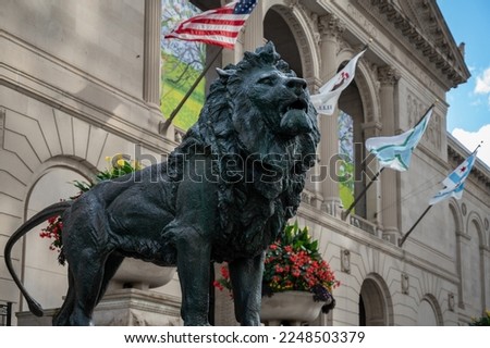 Detail of a metal sculpture of a lion in the streets of Chicago