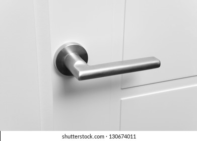 Detail Of A Metallic Knob On White Door Horizontal