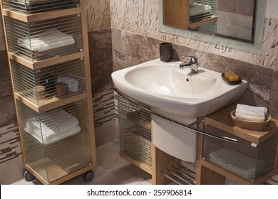 Detail Of A Modern Bathroom With Sink And Cupboard For Towels