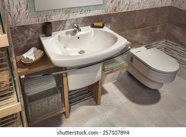 Detail Of A Modern Bathroom With Sink, Toilet And Cabinet