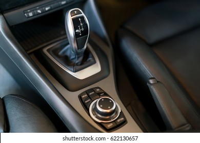 Detail of modern car interior, gear stick, automatic transmission in expensive car