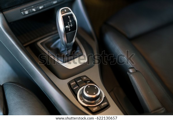 Detail of modern car interior, gear stick,\
automatic transmission in expensive\
car