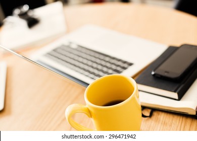 Detail Of Modern Office With Yellow Cup Of Tea.