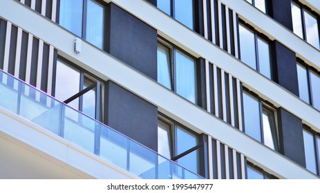 Detail In Modern Residential Flat Apartment Building Exterior. Condominium And Apartment Building With  Symmetrical Modern Architecture. 