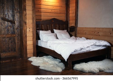 Detail Of Mountain Wooden Lodge Bedroom